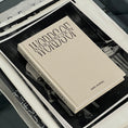 Load image into Gallery viewer, Stack of books with a beige cover titled 'Words Of Introspection, Lined Journal' by WOI.