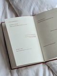 Load image into Gallery viewer, open book on bed