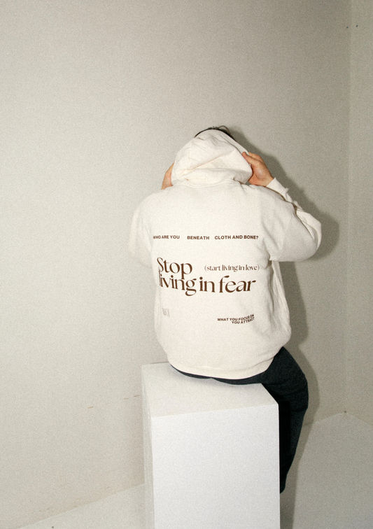 man sitting in hoodie